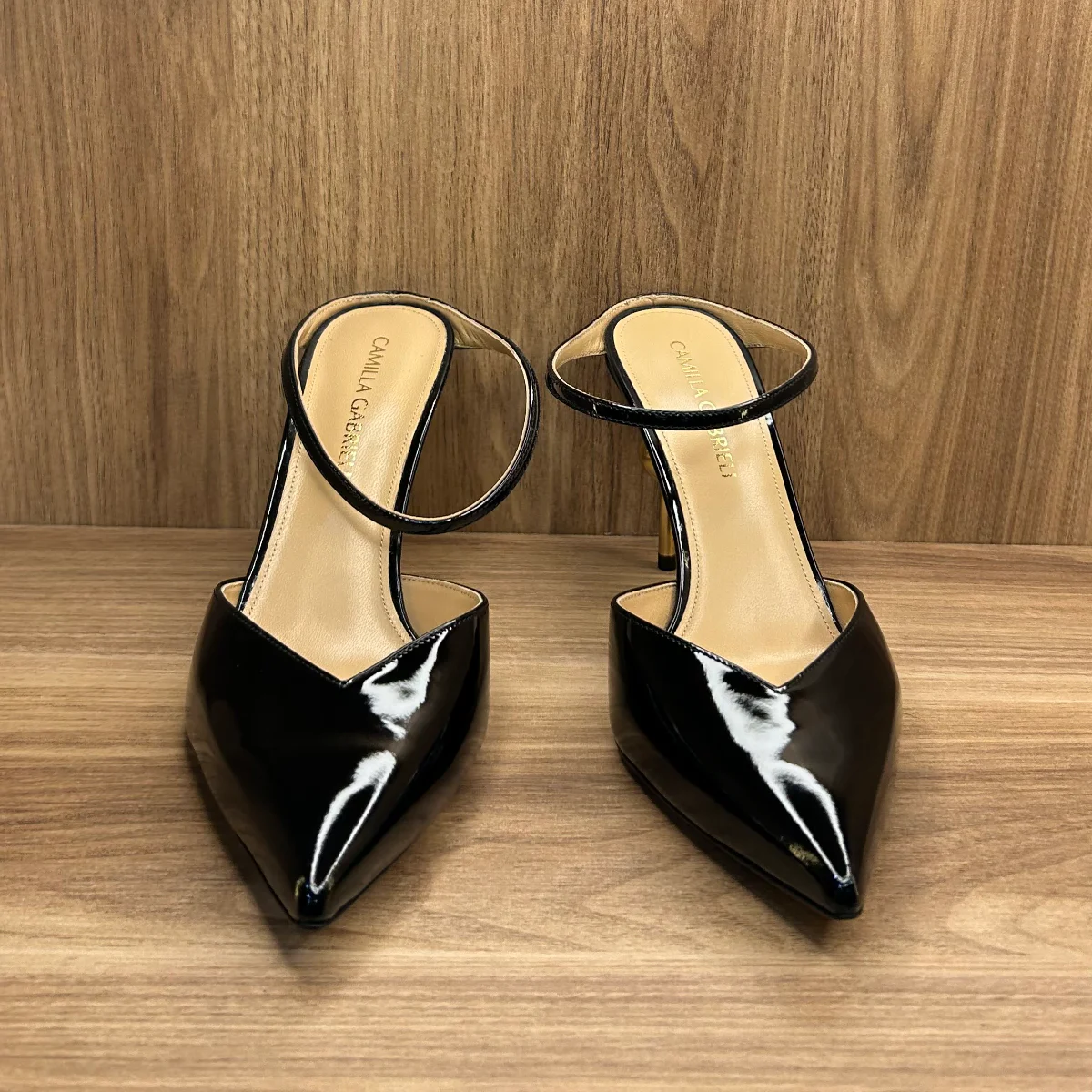 Emma mule shoes in black patent leather with a gold -tone sphere heel