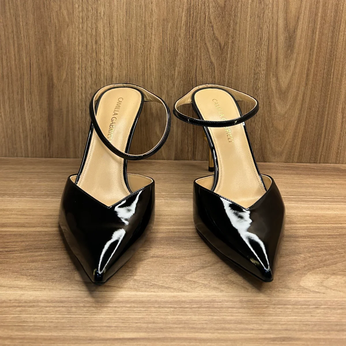 Emma mule shoes in black patent leather with a gold -tone sphere heel
